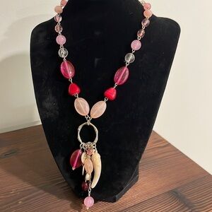 Pink beaded charm necklace with stone horn of wealth and silver tone accents
